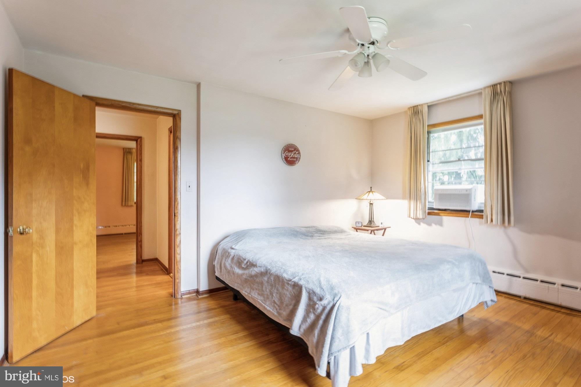 505 Whitaker Mill Road Fallston, MD 21047 - Photo 28 of 49 a bedroom with a bed and a chandelier