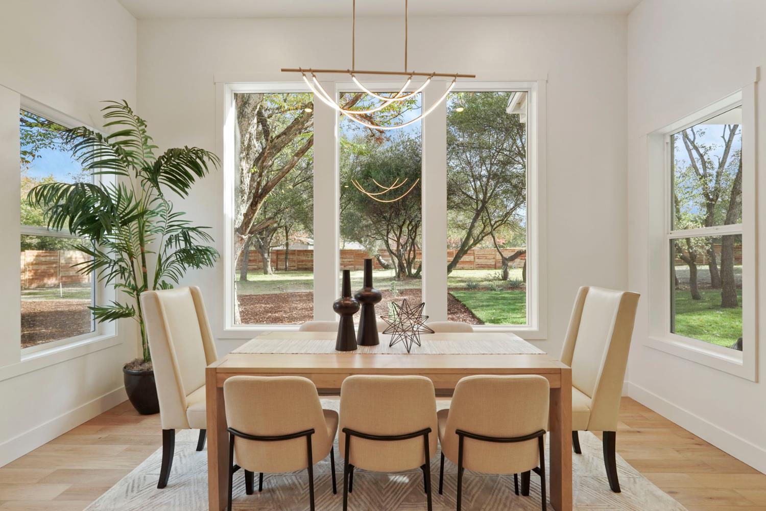 4177 Laird Road Loomis, CA 95650 - Photo 15 of 62 a dining room with furniture a chandelier and wooden floor
