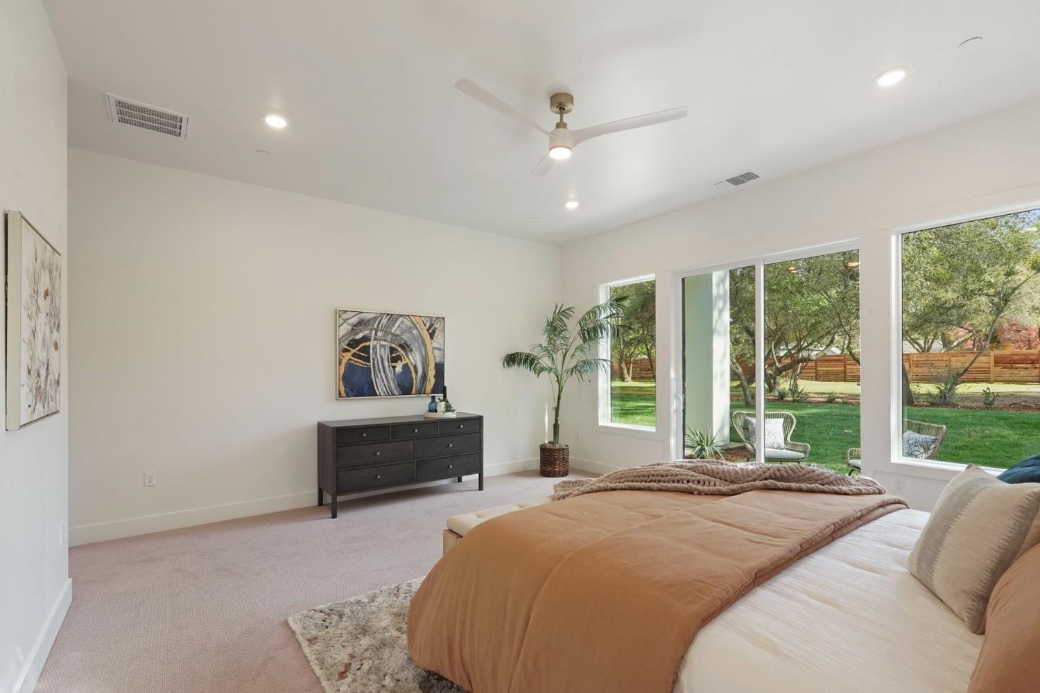 4177 Laird Road Loomis, CA 95650 - Photo 25 of 62 a bedroom with a large bed and a window