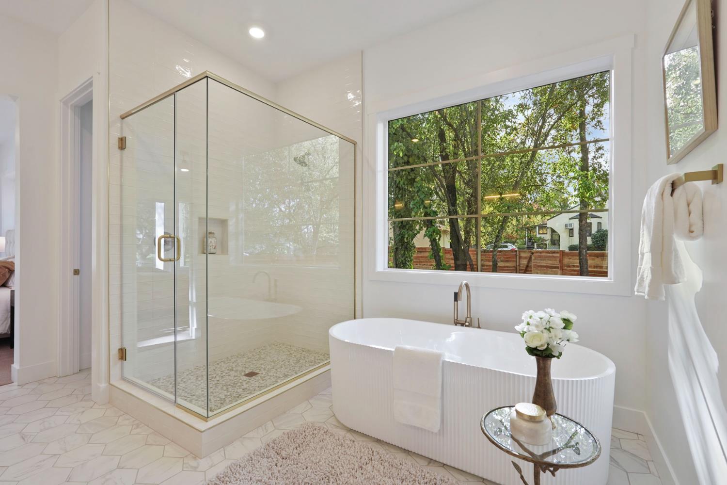 4177 Laird Road Loomis, CA 95650 - Photo 27 of 62 a bathroom with a tub shower and window