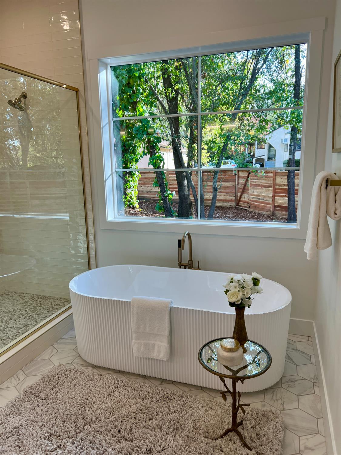4177 Laird Road Loomis, CA 95650 - Photo 29 of 62 a white bath tub sitting in a bathroom next to a window