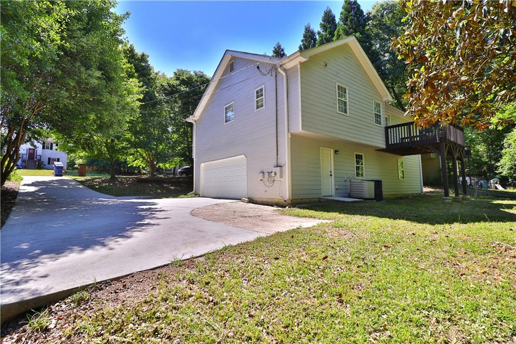 353 Fall View Court Winder, GA 30680 - Photo 6 of 61 a front view of a house with a yard and garage