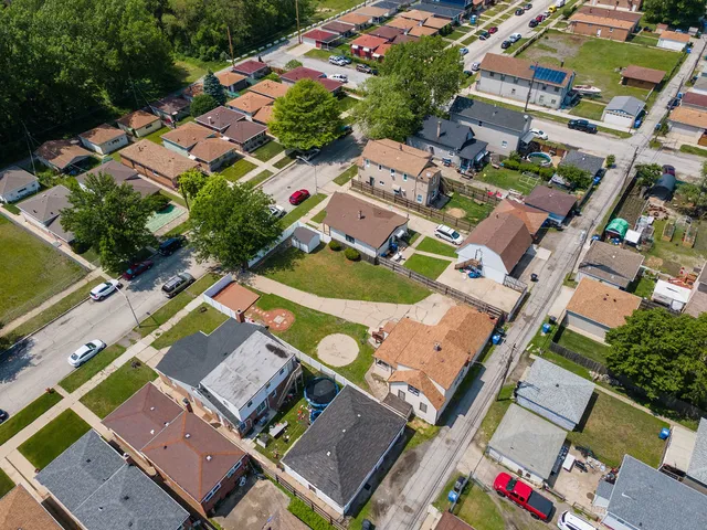 an aerial view of a house with a garden