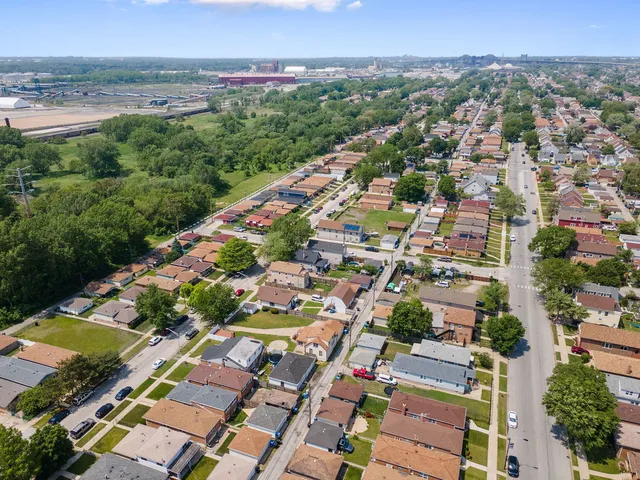 an aerial view of residential houses with outdoor space