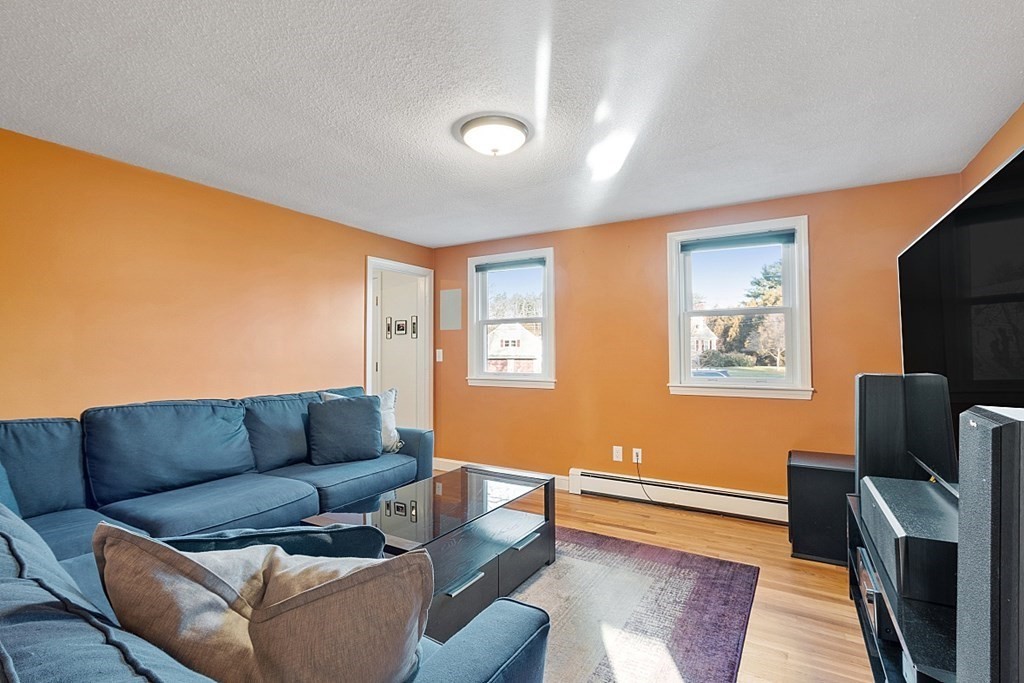 16 Winslow Road Chelmsford, MA 01824 - Photo 14 of 35 a living room with furniture and a flat screen tv