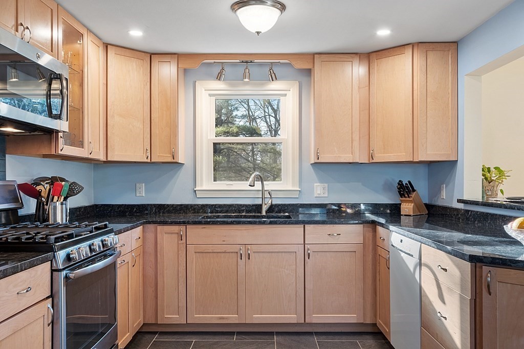 16 Winslow Road Chelmsford, MA 01824 - Photo 4 of 35 a kitchen with granite countertop a sink window and cabinets