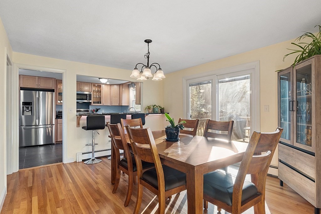 16 Winslow Road Chelmsford, MA 01824 - Photo 5 of 35 a dining room with furniture a chandelier and window