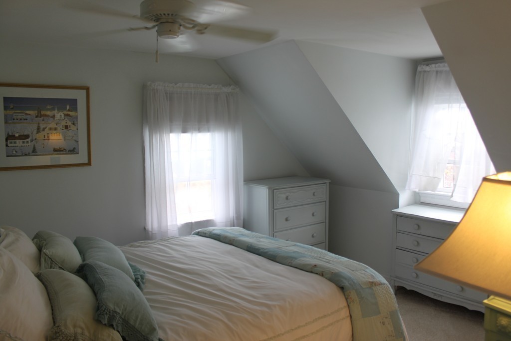 14 Brookline Road Scituate, MA 02066 - Photo 22 of 30 a bedroom with a bed and window