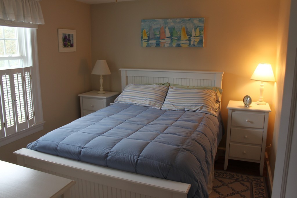 14 Brookline Road Scituate, MA 02066 - Photo 23 of 30 a bedroom with a bed and a window