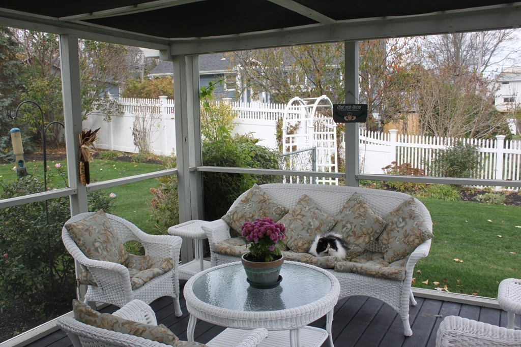 14 Brookline Road Scituate, MA 02066 - Photo 25 of 30 a view of a patio with a table chairs and a backyard
