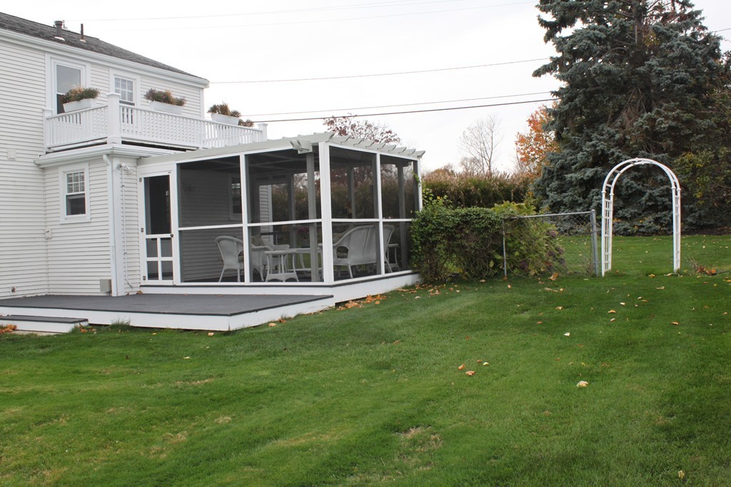 14 Brookline Road Scituate, MA 02066 - Photo 4 of 30 a backyard of a house with table and chairs
