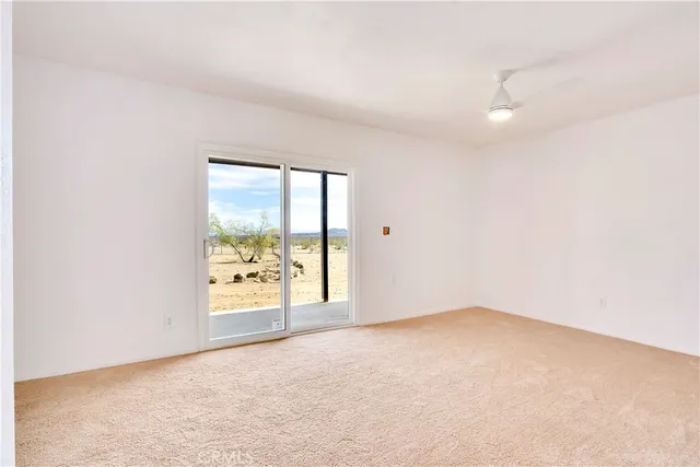 an empty room with a empty space and window