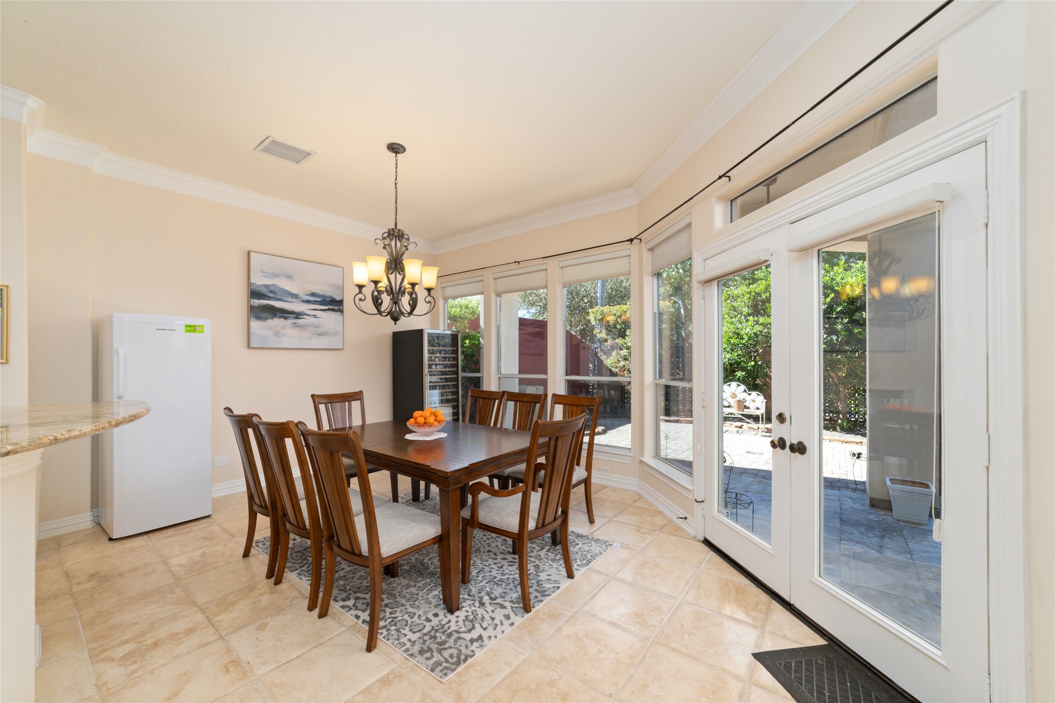 1126 Gardencrest Lane Houston, TX 77077 - Photo 17 of 31 a dining room with furniture a chandelier and wooden floor