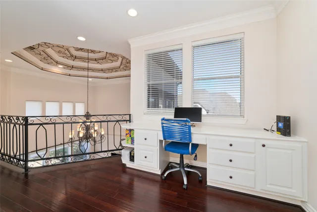 a work room with furniture and wooden floor