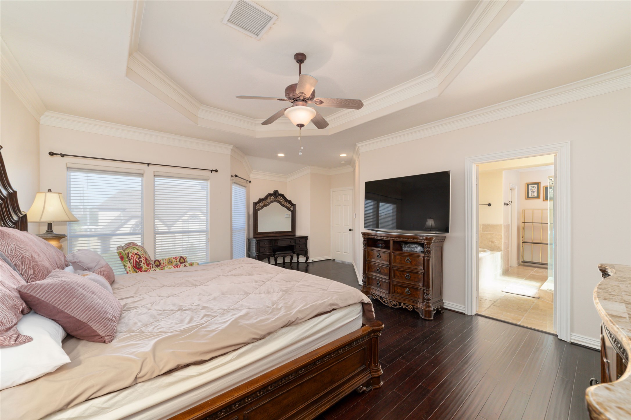 1126 Gardencrest Lane Houston, TX 77077 - Photo 19 of 31 a bedroom with a bed and a flat screen tv