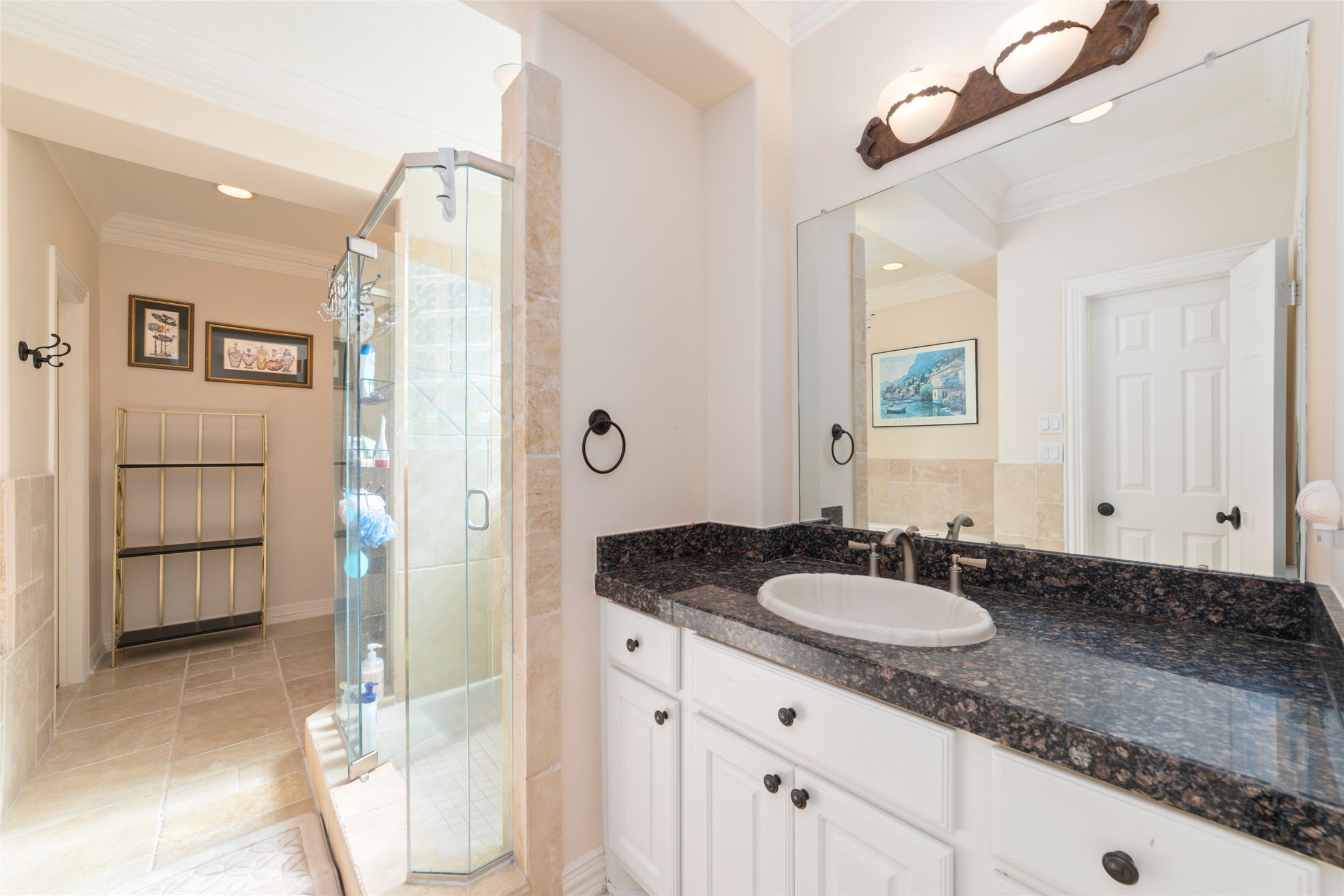 1126 Gardencrest Lane Houston, TX 77077 - Photo 23 of 31 a bathroom with a granite countertop sink and a mirror