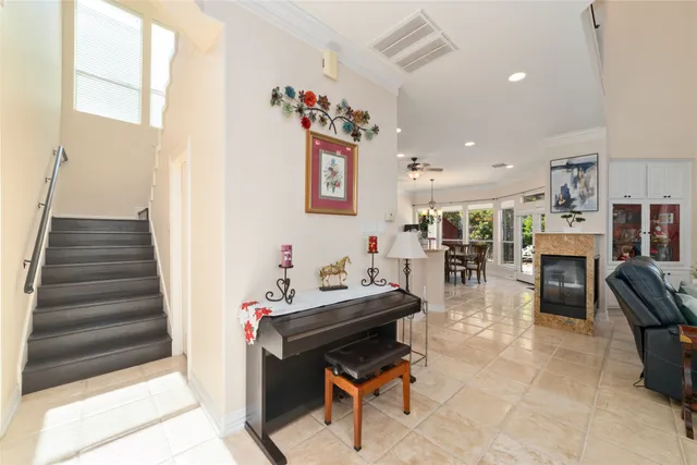 a living room with furniture and kitchen view