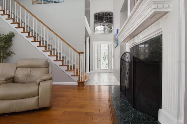 a living room with furniture and a fireplace
