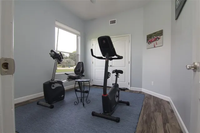 a view of workspace with gym equipment