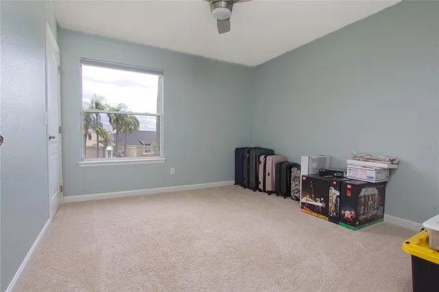 an empty room with furniture and window
