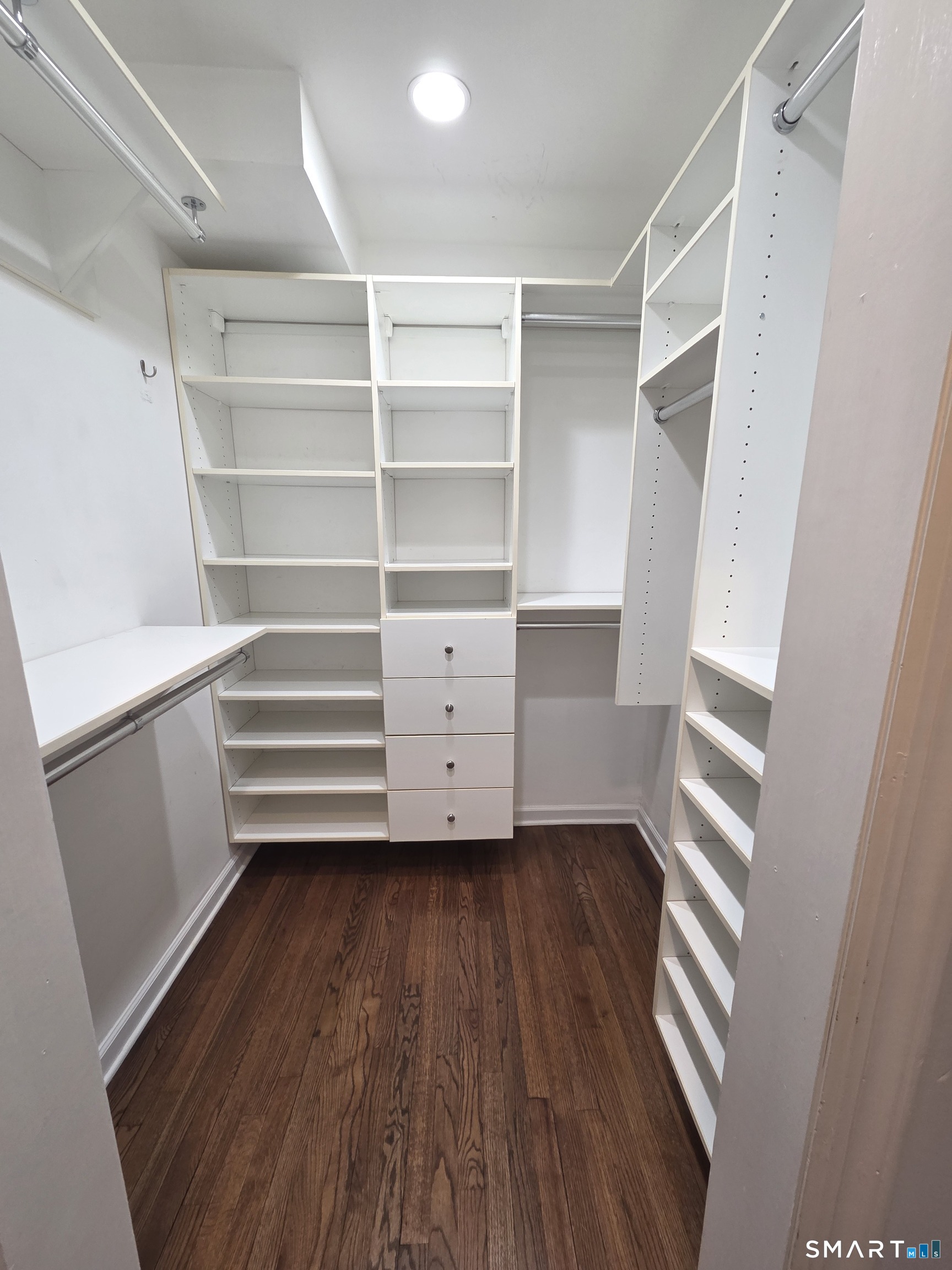 51 Glendale Road Stamford, CT 06905 - Photo 11 of 17 a view of walk in closet with empty racks