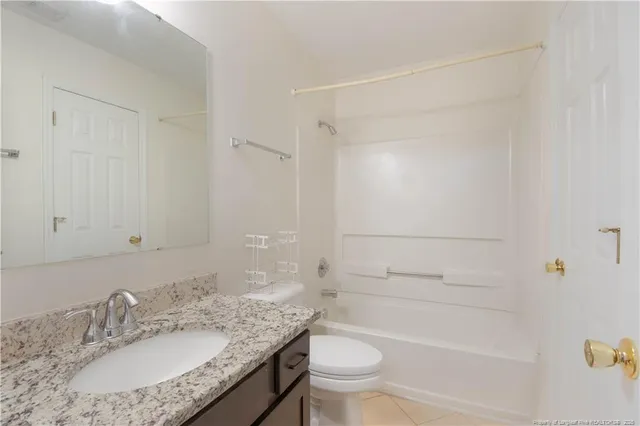 a kitchen with granite countertop stainless steel appliances and wooden cabinets