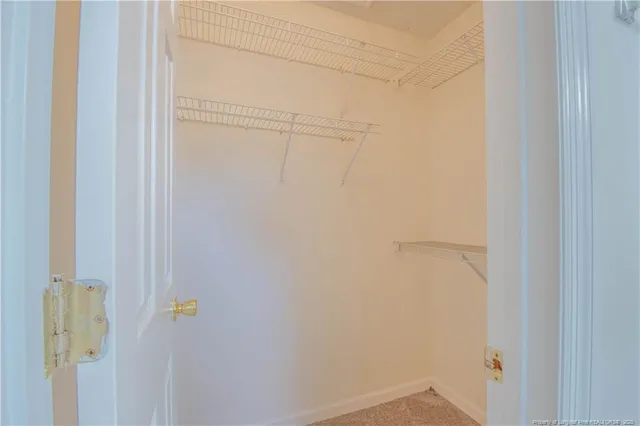 a bathroom with a granite countertop sink and a bathtub