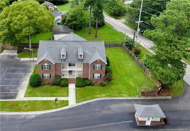 an aerial view of house with yard swimming pool and outdoor seating