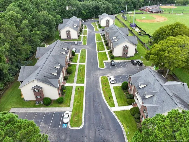 a view of yard with swimming pool and outdoor seating