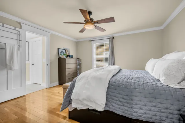 a bedroom with a bed and window