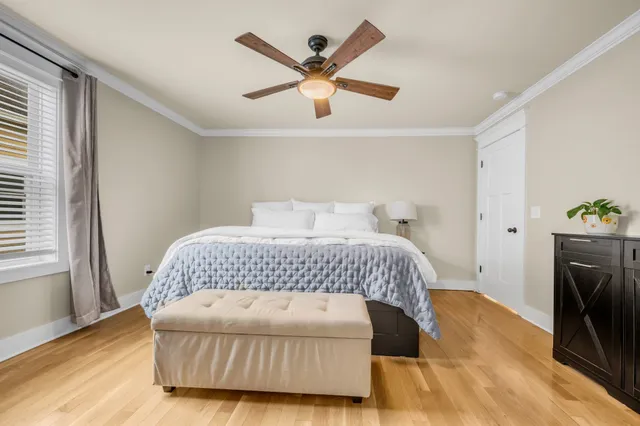 a bedroom with a bed and window