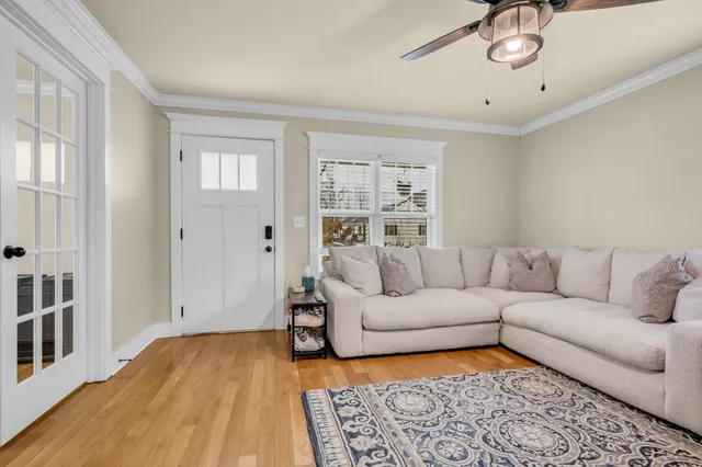 a living room with furniture and a rug