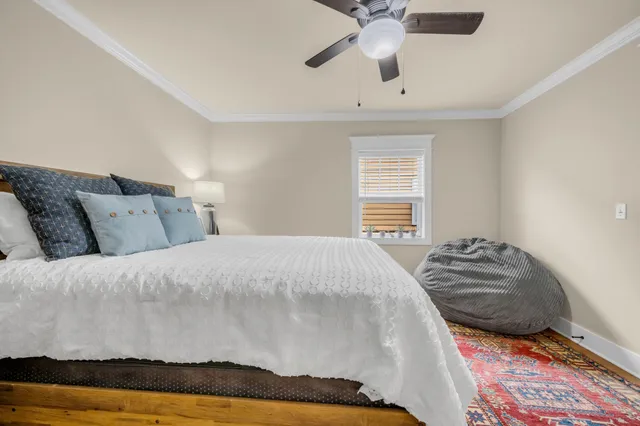 a bedroom with a bed and window