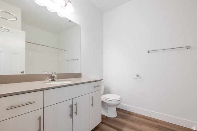 4662 Poplar Way, Unit Q301 Mapleton, UT 84664 - Photo 14 of 18 Bathroom with vanity, dark wood-style floors, and a shower