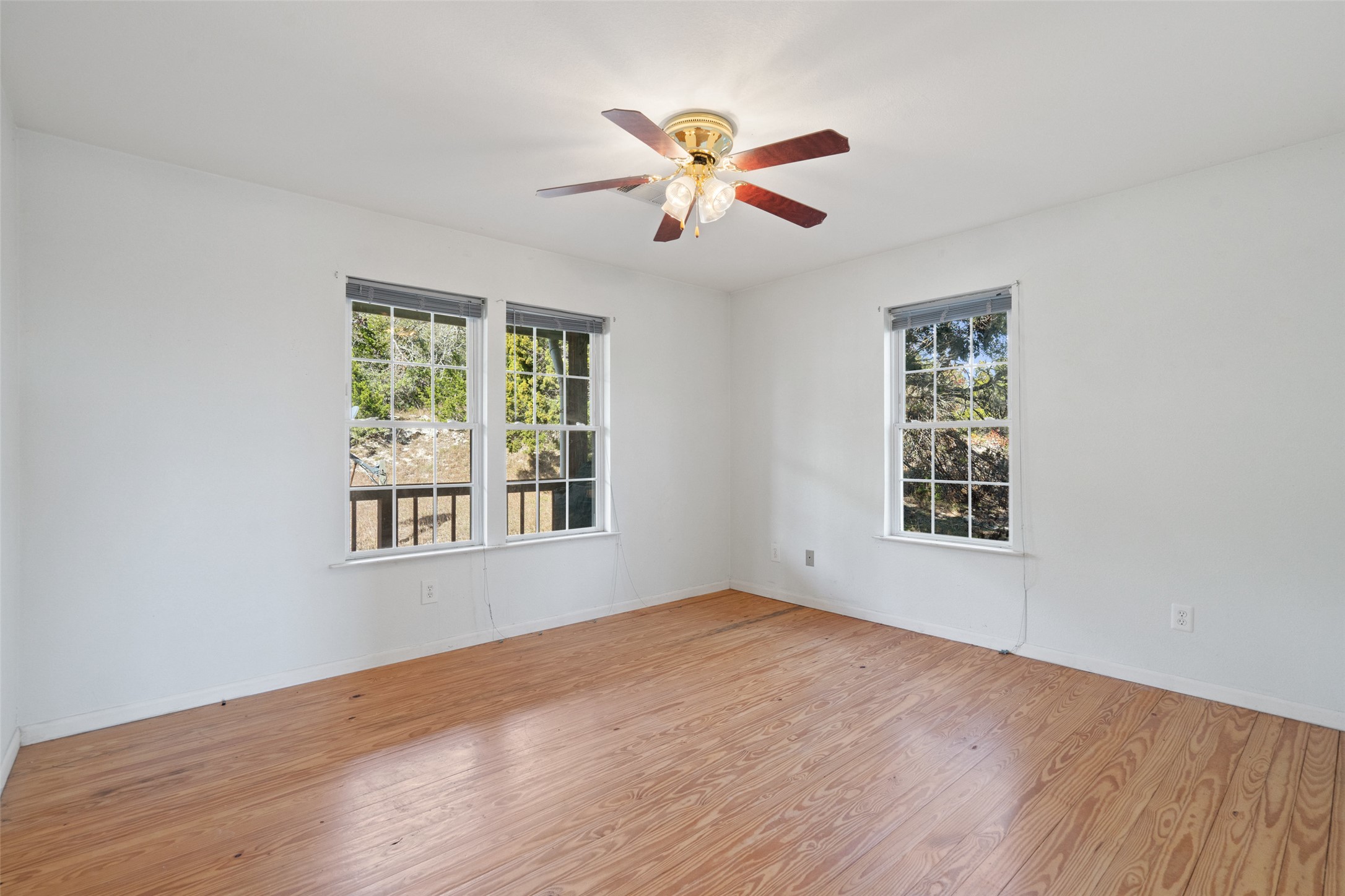 1401 Pursley Road Dripping Springs, TX 78620 - Photo 17 of 35 Bedroom with hardwood / wood-style floors and ceiling fan