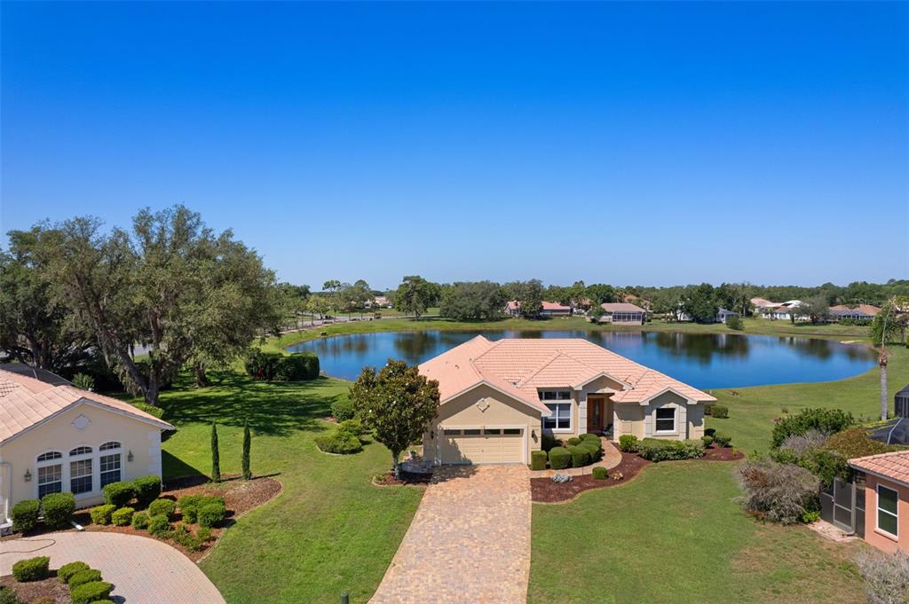 10081 Georgetown Court Weeki Wachee, FL 34613 - Photo 3 of 76 a view of a lake with houses