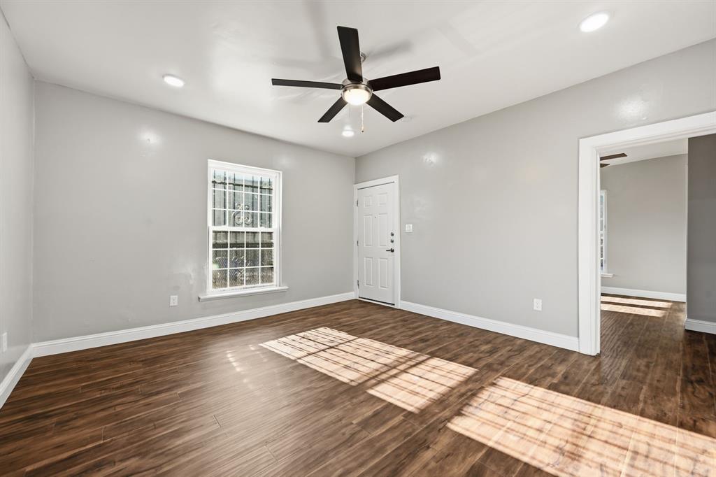4219 Frank Street Dallas, TX 75210 - Photo 14 of 23 a view of empty room with wooden floor and fan