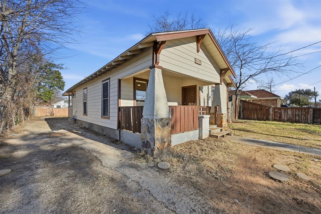 4219 Frank Street Dallas, TX 75210 - Photo 22 of 23 a view of a house with a yard