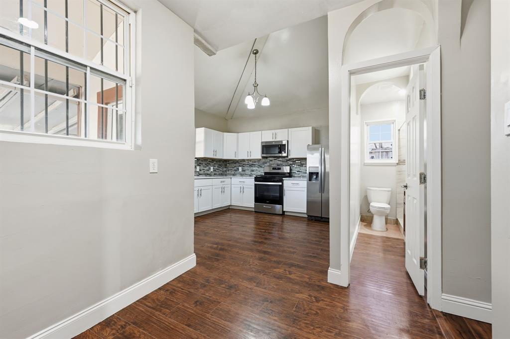4219 Frank Street Dallas, TX 75210 - Photo 4 of 23 a view of a kitchen from the hallway