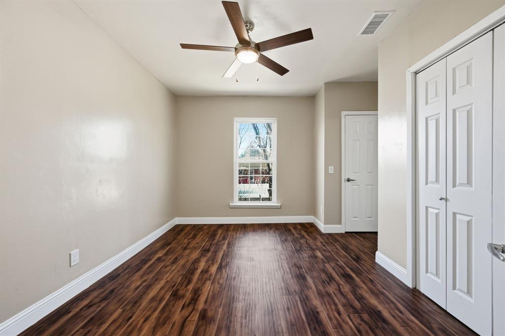 4219 Frank Street Dallas, TX 75210 - Photo 10 of 23 wooden floor in an empty room with a window