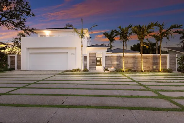 a view of closet with wooden floor and a window