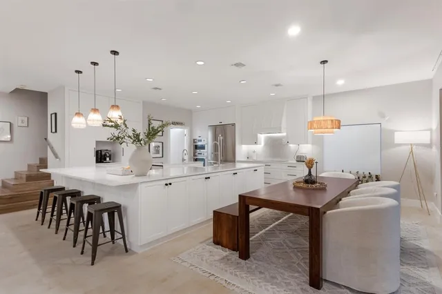 a dining room with furniture and wooden floor