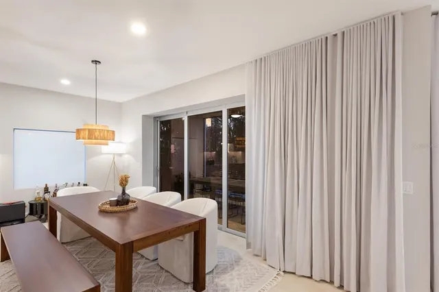 a kitchen with a table and chairs