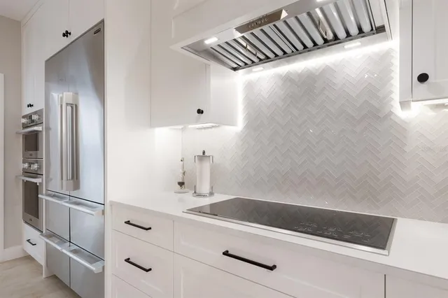 a bedroom with a bed and potted plant