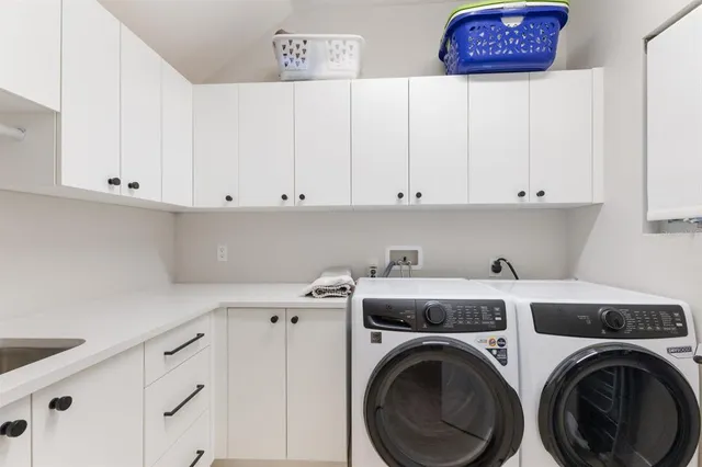 a bedroom with a bed and a television