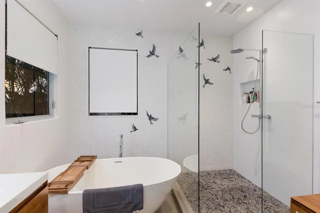 a kitchen with kitchen island a sink and wooden floor