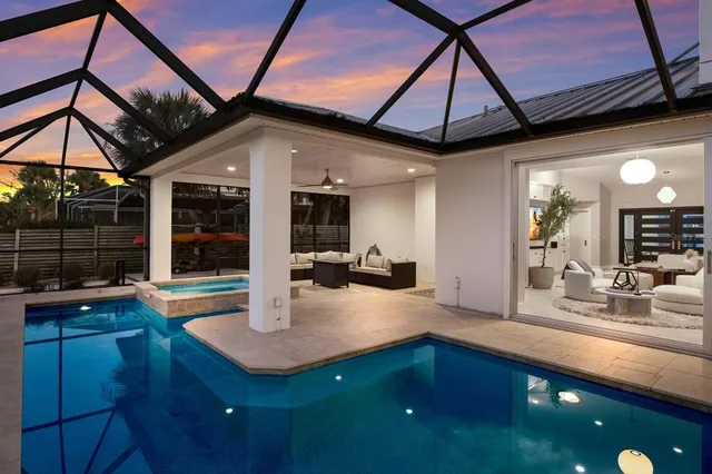 a view of a backyard with sitting area