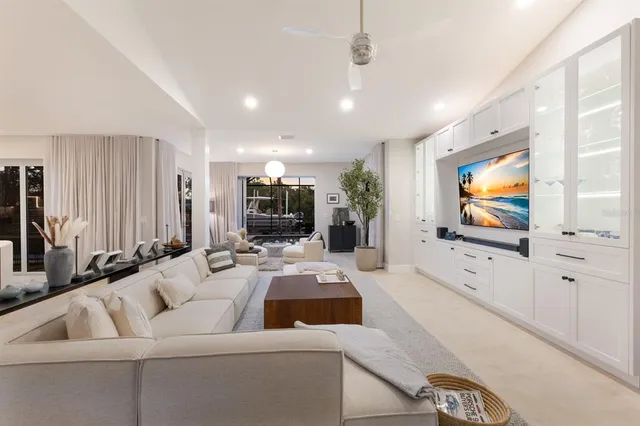 a kitchen with stainless steel appliances granite countertop a sink and a refrigerator