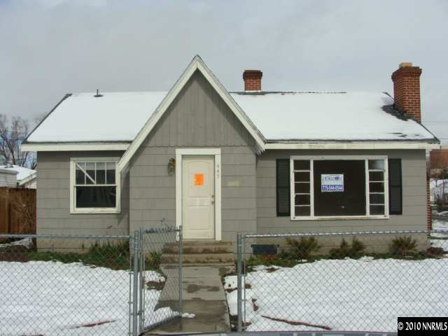 445 Wonder Street Reno, NV 89502 - Photo 1 of 1 a front view of a house with a yard
