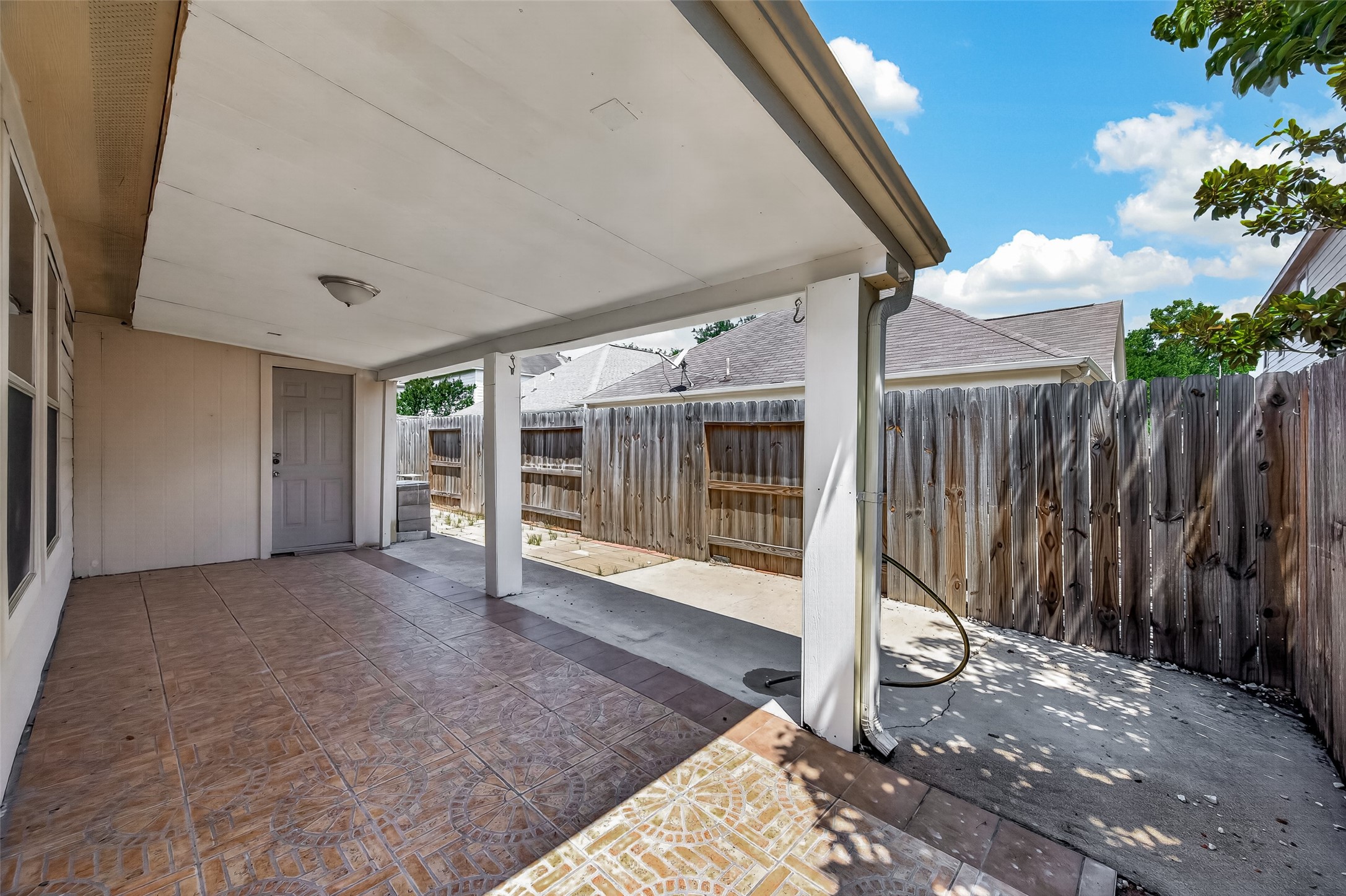 19322 Dawn Canyon Road Houston, TX 77084 - Photo 33 of 37 Covered patio area with tiled flooring,